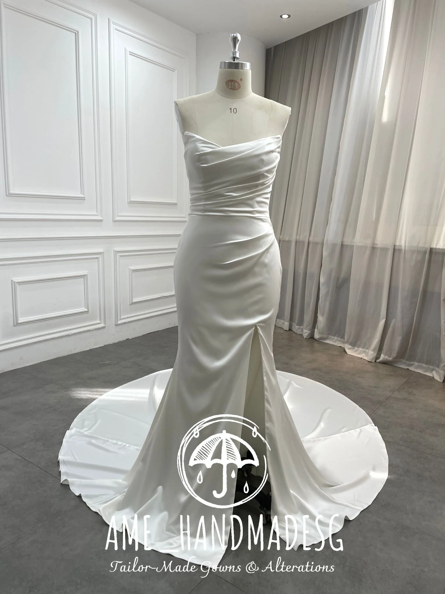 Pure Grace: A Minimalist Satin Mermaid Gown with Buttoned Train