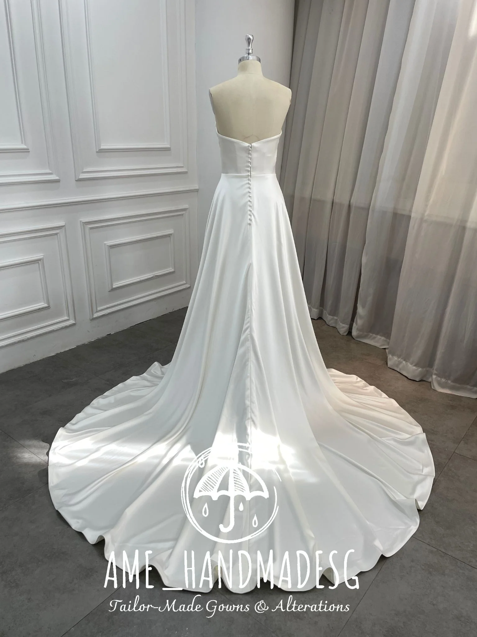 Timeless Serenity: A Classic Satin A-Line Wedding Gown with Elegant Train - Image 2